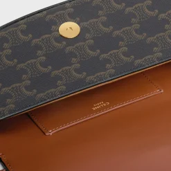 Online CLUTCH ON STRAP TABOU in Triomphe canvas and calfskin Women Triomphe Canvas