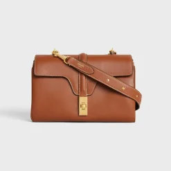 New LONG STRAP in smooth CALFSKIN WITH TRIOMPHE STUDS with Gold Finishing Women Categories·Straps And Accessories