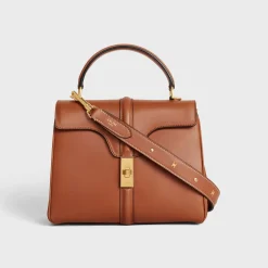 New LONG STRAP in smooth CALFSKIN WITH TRIOMPHE STUDS with Gold Finishing Women Categories·Straps And Accessories