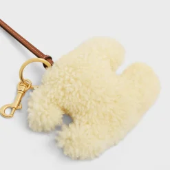 Clearance TRIOMPHE pom-pom keyring in SHEARLING AND SMOOTH CALFSKIN with Gold Finishing Women Categories·Straps And Accessories